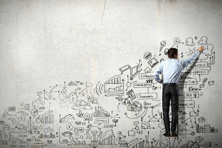 Man scribbling on whiteboard